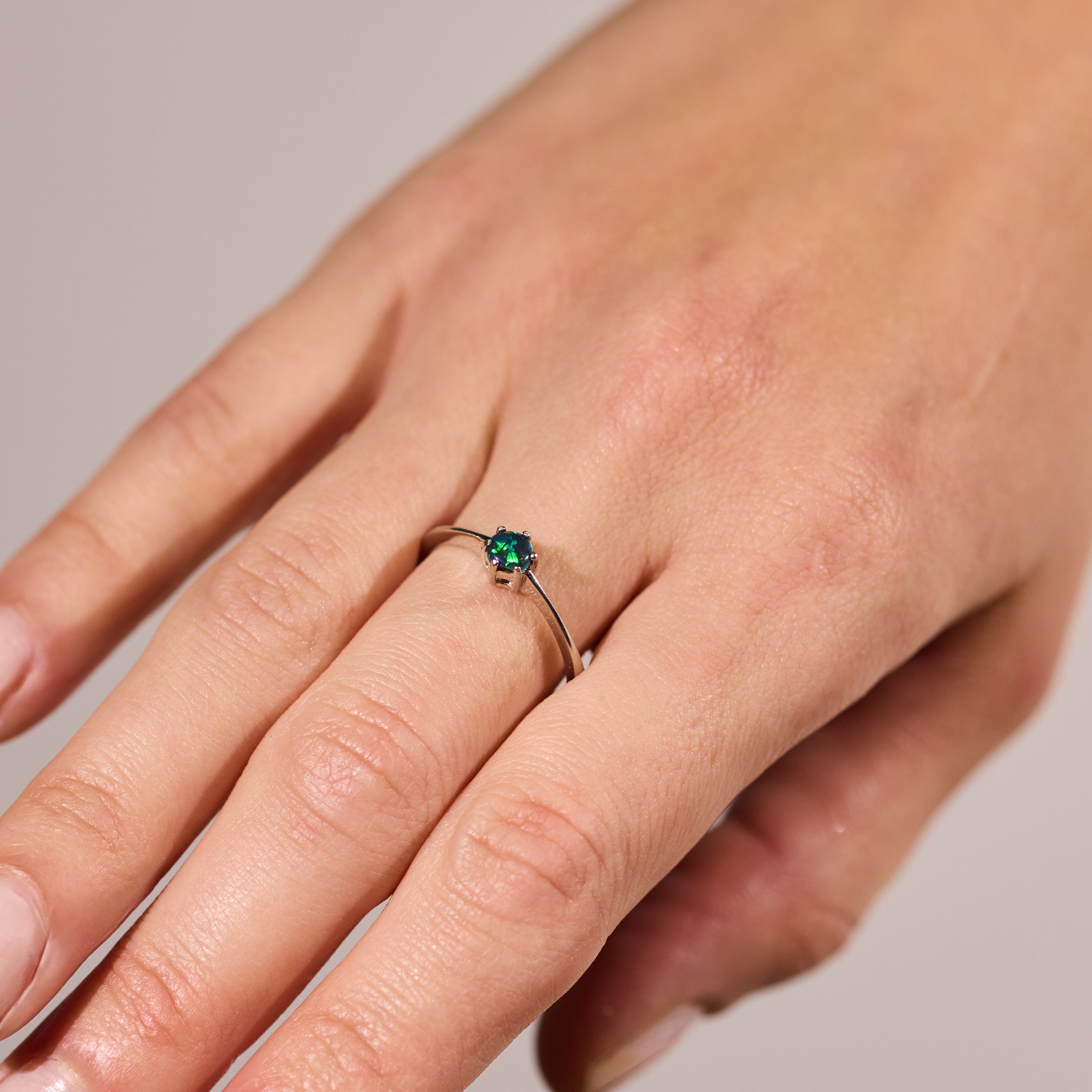 black opal ring elegant design sterling silver claw ring deep blue and green stone colours