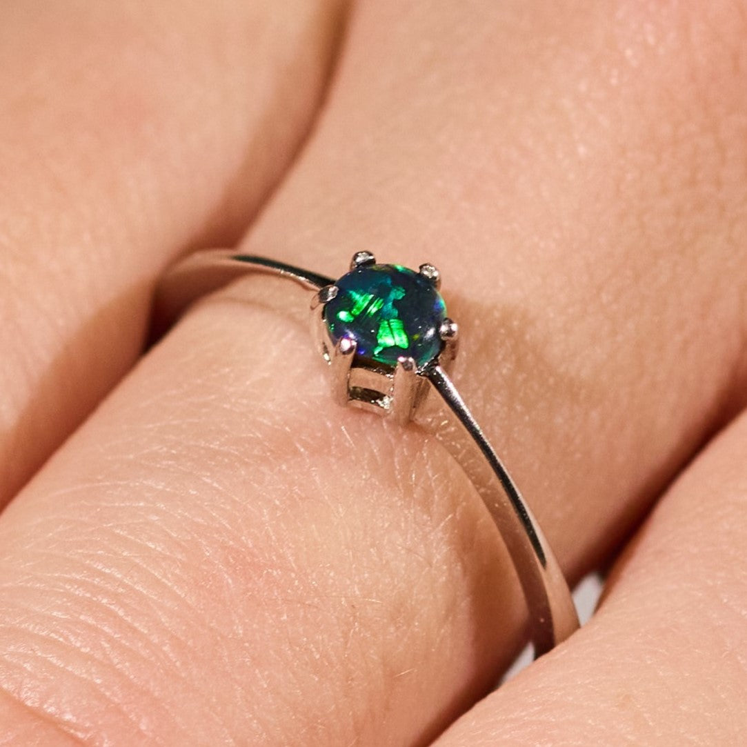 black opal ring elegant design sterling silver claw ring deep blue and green stone colours