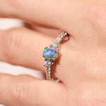 black opal ring elegant engagement design sterling silver claw ring, purple, green and blue stone colours